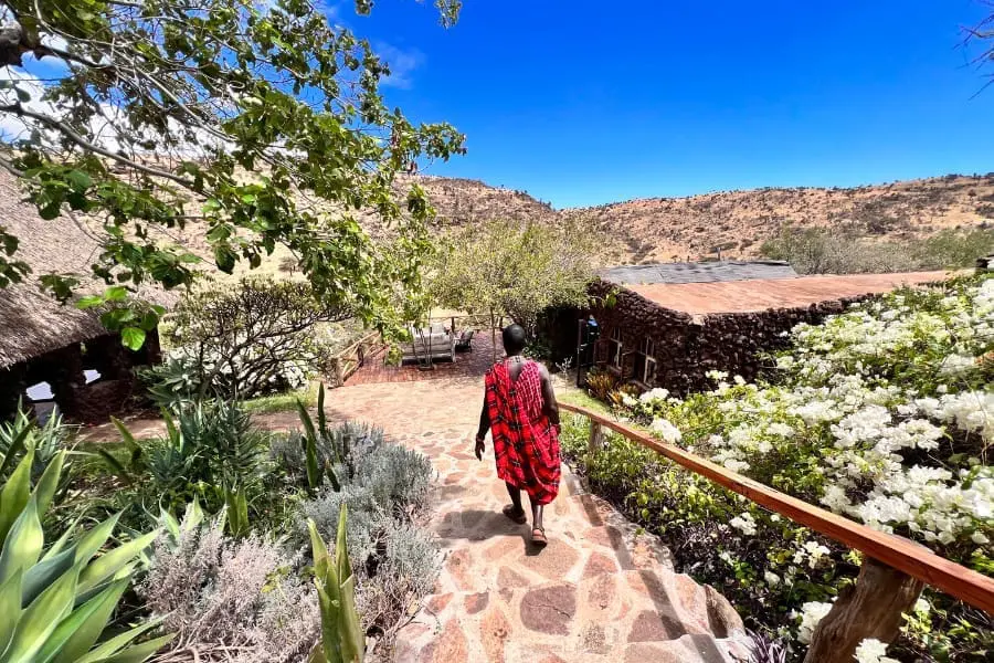 A Maasai guide leads the way for guests at Lewa Safari Camp in Kenya | Go2Africa