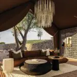 Savour relaxation in the lounge area, sipping whiskey.