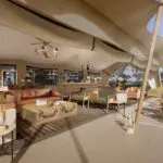 A spacious outdoor lounge offers respite from the sun while keeping you immersed in nature.
