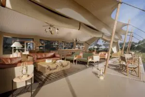 A spacious outdoor lounge offers respite from the sun while keeping you immersed in nature.