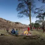 Engage in lively conversation with guides and fellow guests around the campfire.