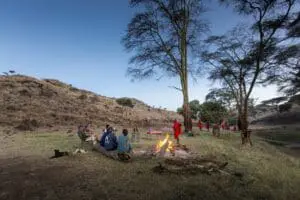 Engage in lively conversation with guides and fellow guests around the campfire.