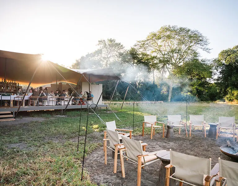 The fire in front of camp will be lit and boiling water for your first coffee of the day before your morning game drive.