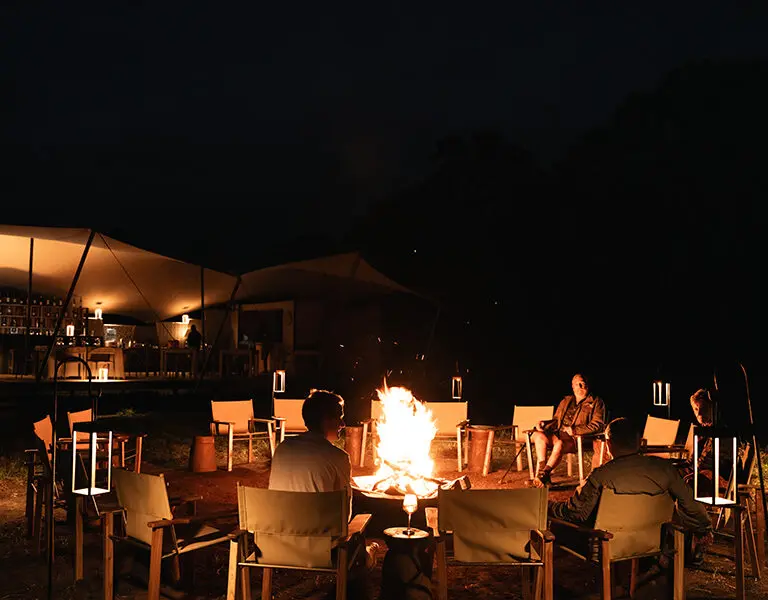 Gather around the firepit to enjoy the warmth and crackle of the campfire.