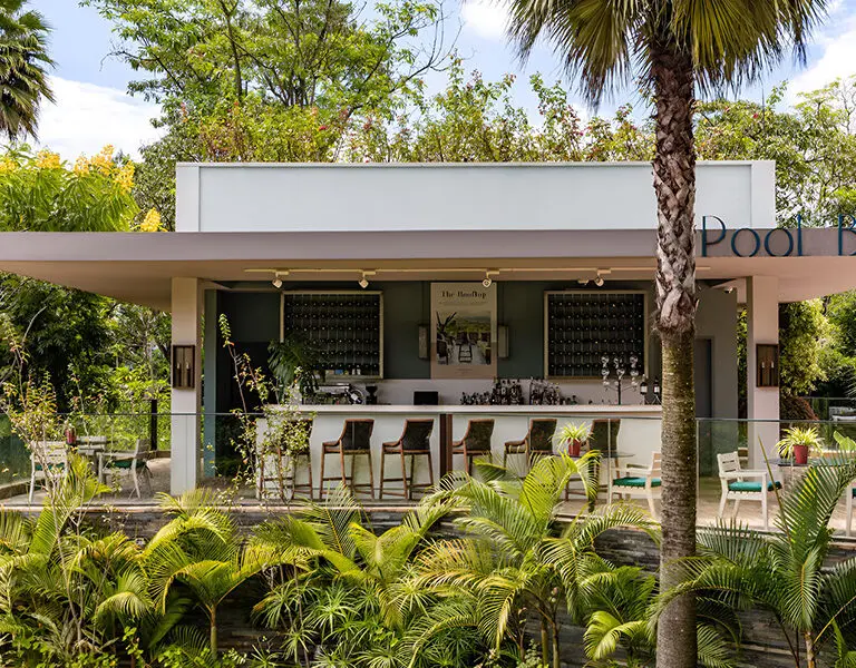 Enjoy drinks at the pool bar. 