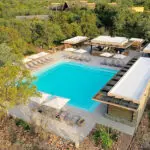 Take a dip in the pool and sip on a drink, relaxing on the loungers.