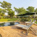 Swimming pool and loungers.