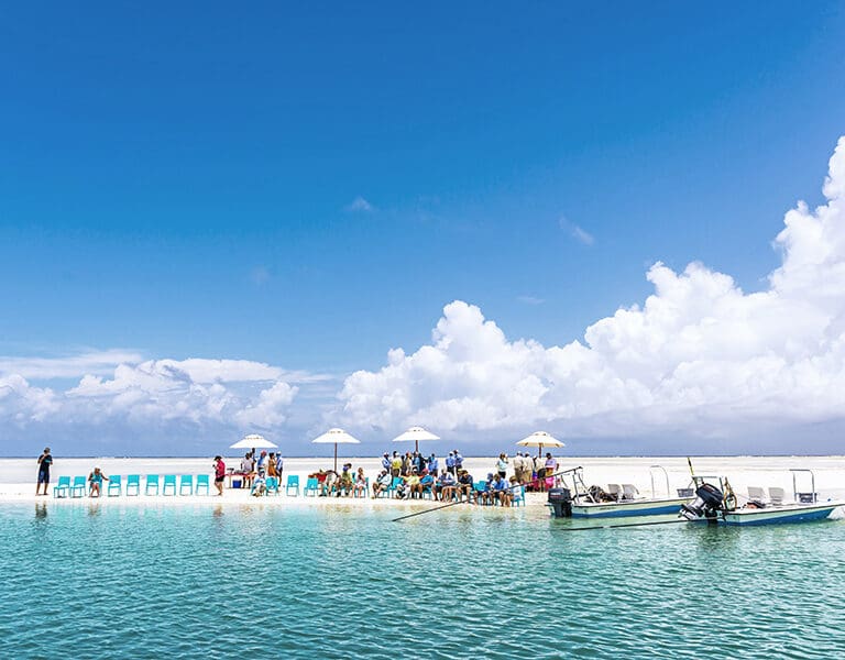 Delight in a lunch on an island flat, surrounded by the azure Indian Ocean waters. 