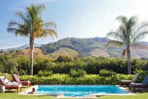 Enjoy dips in the pool set against a picturesque backdrop. 