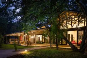 The Manor takes on fairy-tale majesty as the sunsets and lanterns are lit across the terrace.