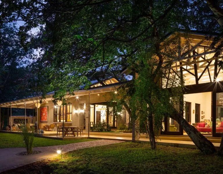 The Manor takes on fairy-tale majesty as the sunsets and lanterns are lit across the terrace.