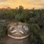 Savour boma dining around the fire pit.