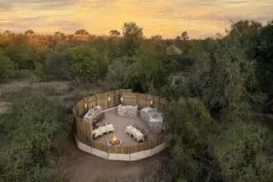 Savour boma dining around the fire pit.