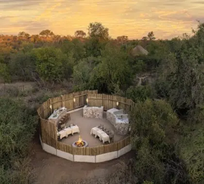 Savour boma dining around the fire pit.
