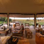 The lounge and deck at Nkasa Linyanti.