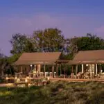The firepit and lounge exterior at Nkasa Linyanti | Image is an artist's render.