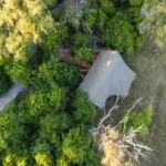 Each tent is tucked in between trees to extra privacy.