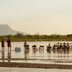 Savour sundowners in the river.