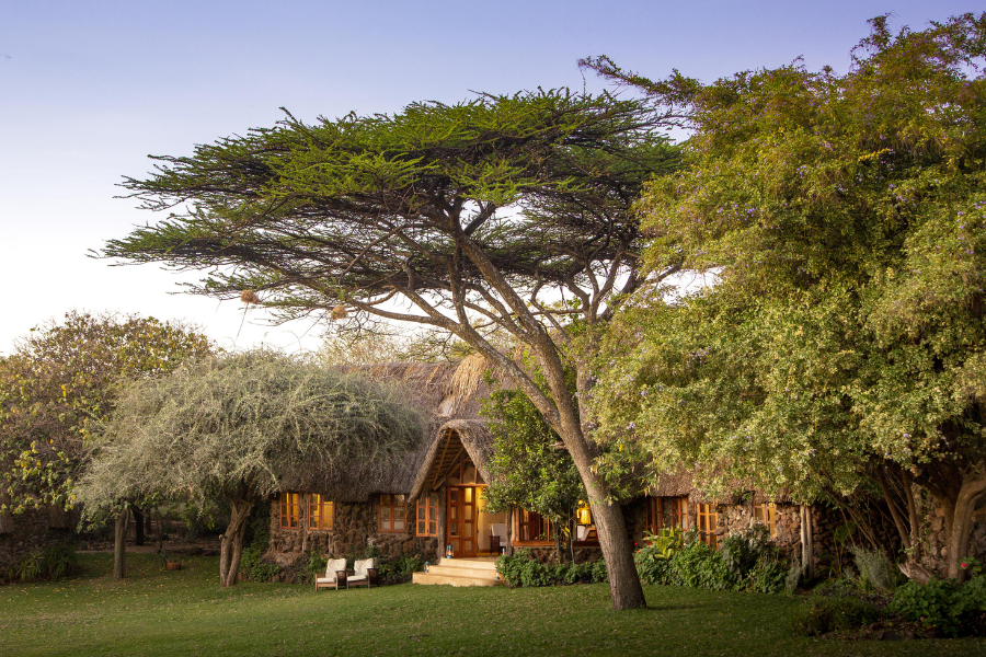 A cottage at Lewa Wilderness Lodge surrounded by green valleys | Go2Africa