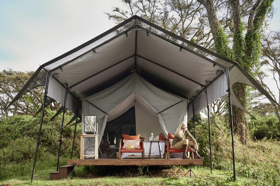 A tent at Ngorongoro Crater Camp, positioned on the crater rim where grassland meets forest | Go2Africa