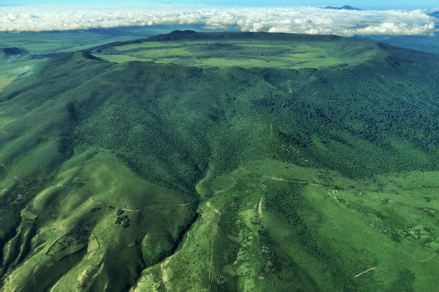 The Highlands set on the slopes of the Olmoti Volcano, as seen from the lodge | Go2Africa
