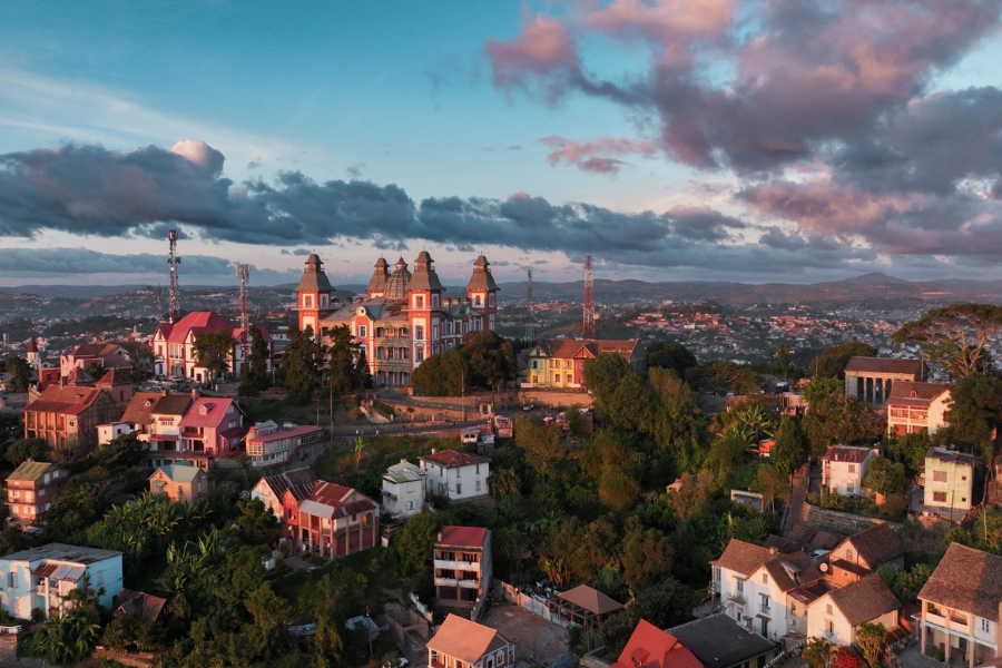 Cityscape with historic buildings overlooking a hillside at sunset | Go2Africa