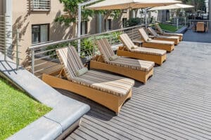 Sun loungers line the pool. 