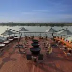 Savour sundowners at the terrace bar overlooking the river below.