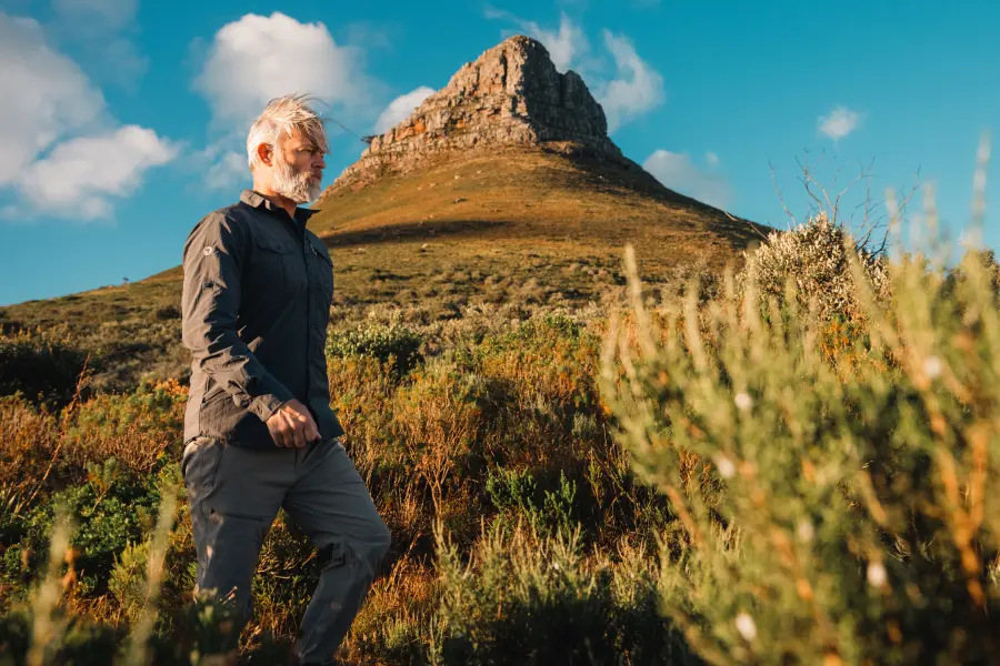 Traveler exploring a mountain landscape in outdoor clothing | Go2Africa