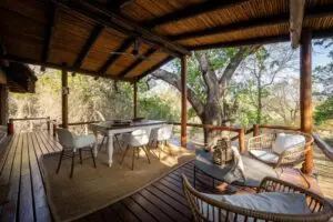 Relax on the spacious deck overlooking the bush below. 