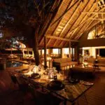 Savour homecooked meals under the African night sky.