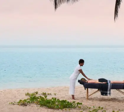 Guest enjoying a beachfront massage at Benguerra Island | Go2Africa