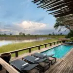 Cool off in the swimming pool overlooking the lagoon.
