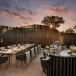 Enjoy dinner beneath the African night sky.