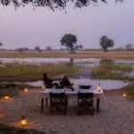 Savour sundowners on the banks of the Delta.
