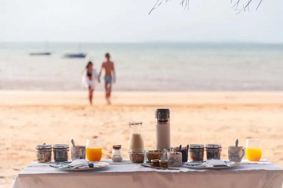 Breakfast table set on the beach overlooking the Indian Ocean | Go2Africa