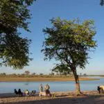 Stay on the banks of the Kwando River.